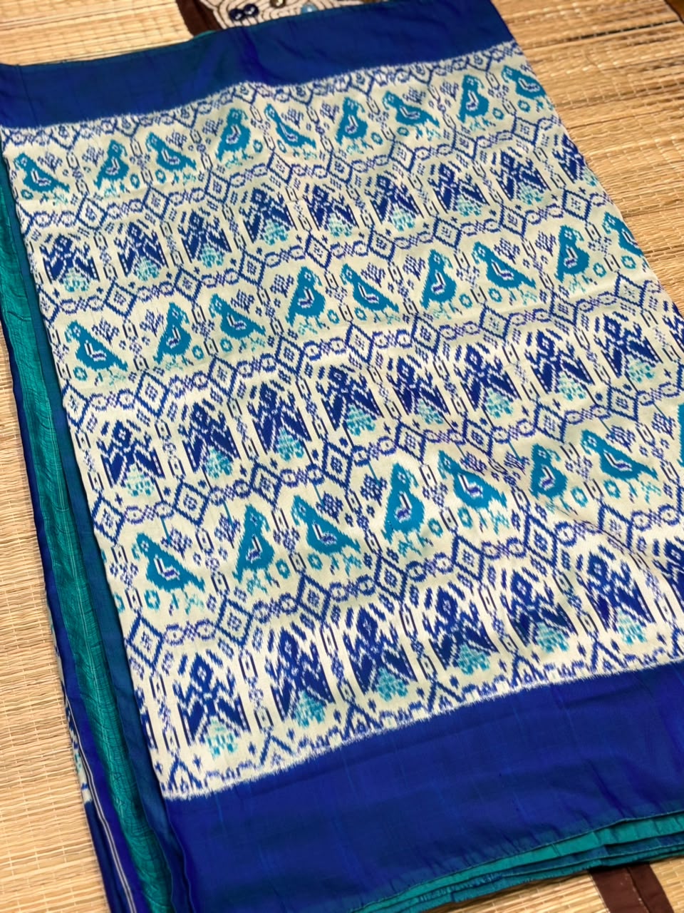 Pure Ikkat Silk Saree with Peacock &amp; Parrot Motifs on Contrast Off-White Border