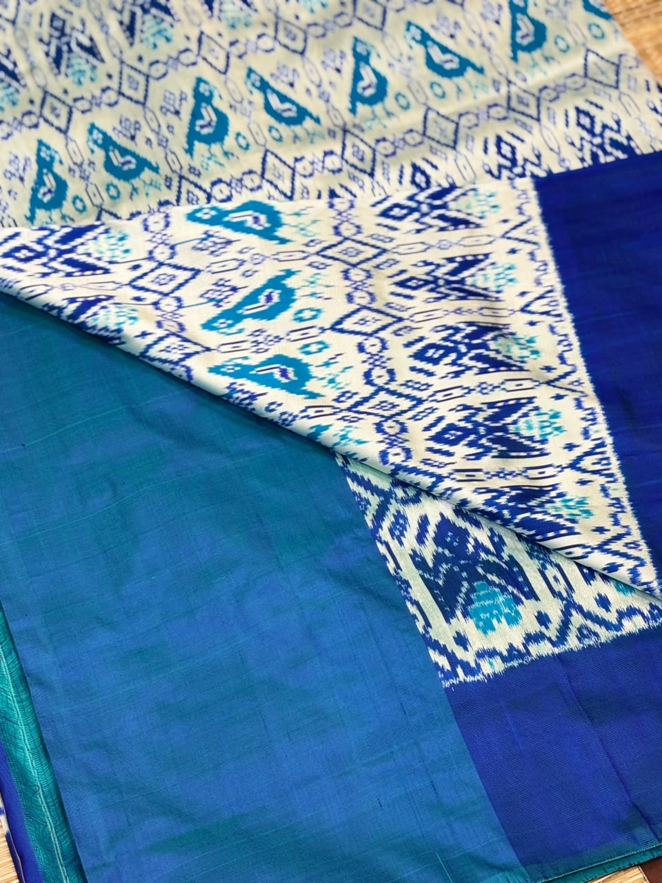 Pure Ikkat Silk Saree with Peacock &amp; Parrot Motifs on Contrast Off-White Border